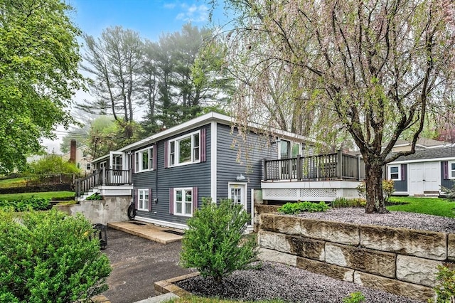 view of front of house featuring a wooden deck