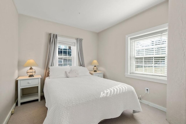 bedroom with light colored carpet