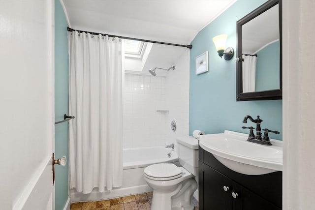 full bathroom with vanity, a skylight, toilet, and shower / bath combo