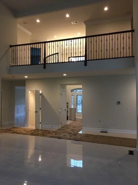 entryway featuring a towering ceiling