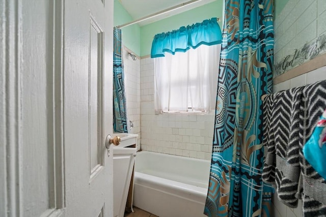 bathroom with shower / bath combination with curtain