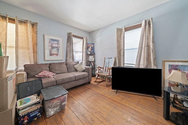 living area featuring plenty of natural light and light wood-style flooring