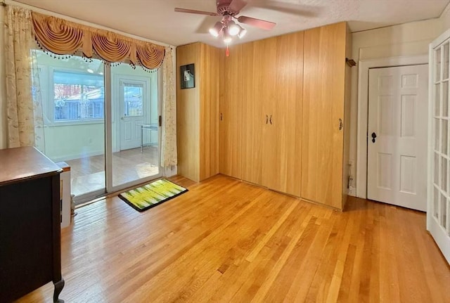 interior space featuring light wood-style floors and a ceiling fan