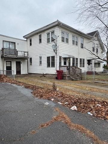 view of front of property with a balcony