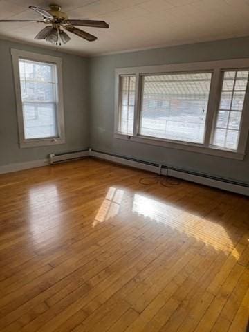 spare room with ceiling fan and light hardwood / wood-style flooring