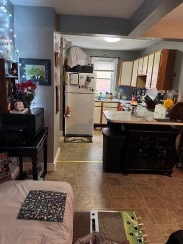 kitchen featuring white fridge