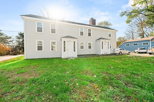 101 Old Westport Rd, Dartmouth, MA 02747 - back of house with a chimney and a lawn