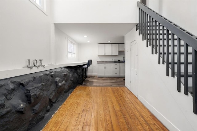 101 Old Westport Rd, Dartmouth, MA 02747 - bar area featuring light wood finished floors, stairway, and recessed lighting