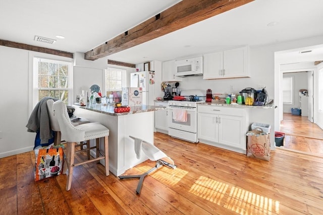 101 Old Westport Rd, Dartmouth, MA 02747 - kitchen featuring white appliances, white cabinets, beam ceiling, and light wood finished floors