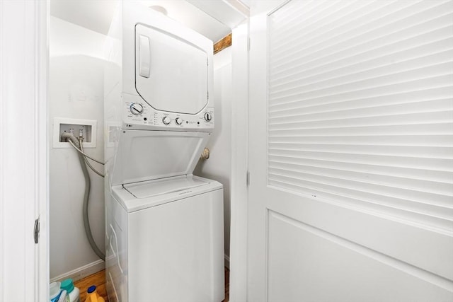101 Old Westport Rd, Dartmouth, MA 02747 - washroom with stacked washing machine and dryer and baseboards