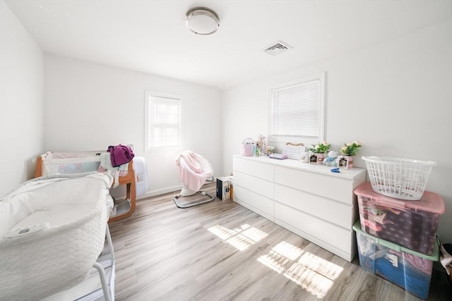 101 Old Westport Rd, Dartmouth, MA 02747 - bedroom with light wood-style floors and baseboards