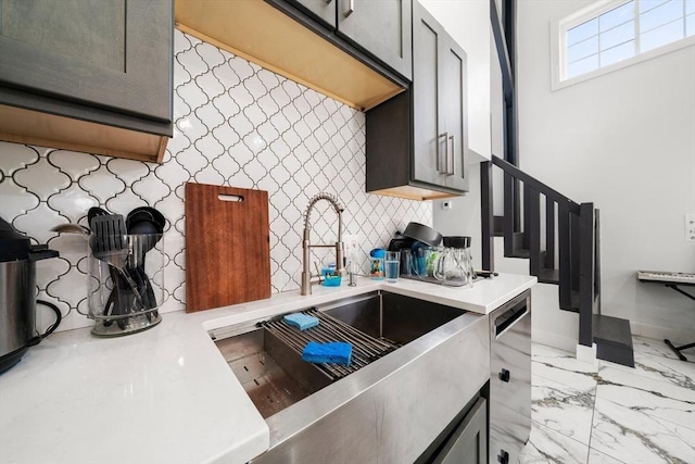 101 Old Westport Rd, Dartmouth, MA 02747 - kitchen with light countertops, backsplash, dishwasher, and light marble finish floors