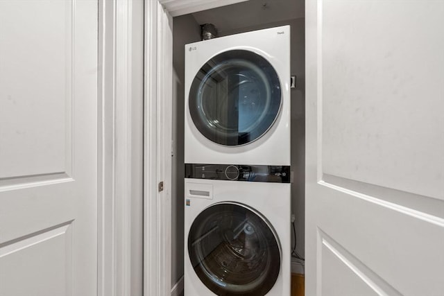 laundry area featuring laundry area and stacked washer / drying machine