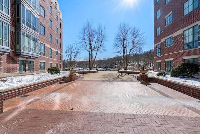 view of road with sidewalks and curbs