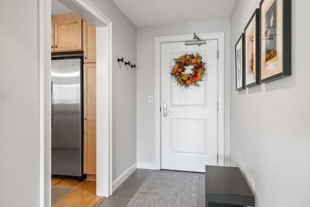 entryway featuring baseboards