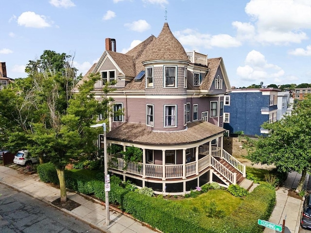 41 Cushing Ave Unit 1, Boston, MA 02125 - rear view of house featuring a chimney, covered porch, and a shingled roof