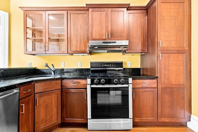 41 Cushing Ave Unit 1, Boston, MA 02125 - kitchen featuring range with gas cooktop, under cabinet range hood, stainless steel dishwasher, glass insert cabinets, and dark stone countertops