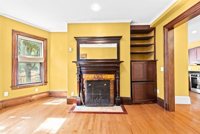 41 Cushing Ave Unit 1, Boston, MA 02125 - unfurnished living room featuring a fireplace with flush hearth, wood finished floors, crown molding, and built in shelves