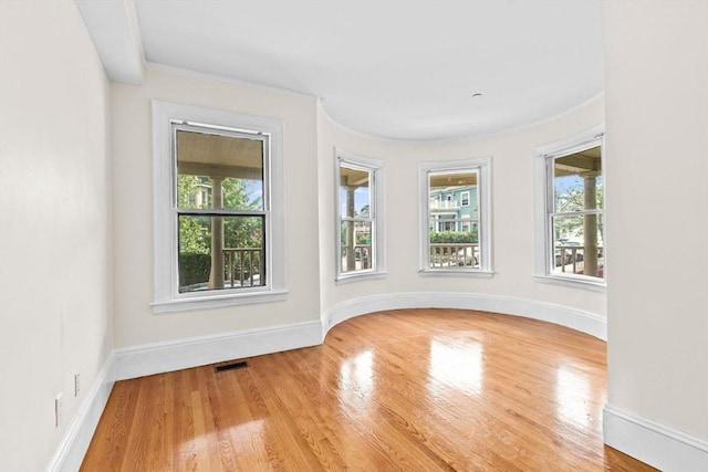 41 Cushing Ave Unit 1, Boston, MA 02125 - spare room with plenty of natural light, wood finished floors, and ornamental molding