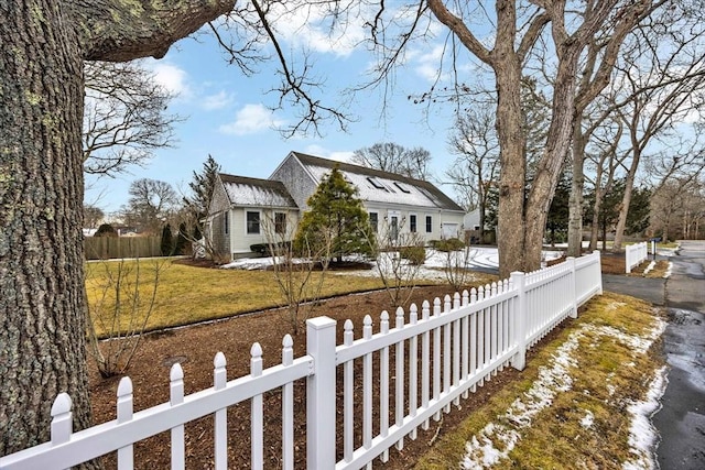 view of home's exterior featuring a yard and a fenced front yard