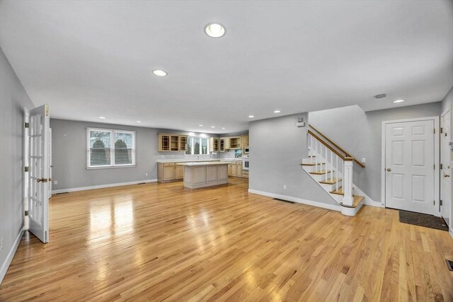 unfurnished living room with light hardwood / wood-style floors