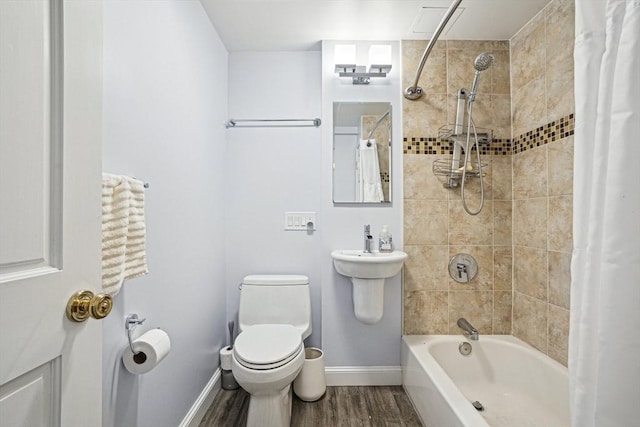 bathroom featuring toilet, shower / tub combo, and hardwood / wood-style flooring