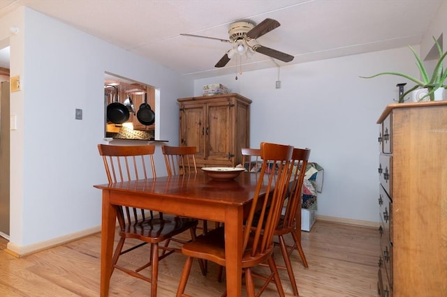 dining space featuring light hardwood / wood-style floors and ceiling fan