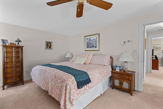 bedroom with baseboards, a ceiling fan, and carpet flooring