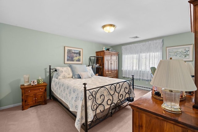 bedroom featuring visible vents, baseboards, baseboard heating, and light carpet