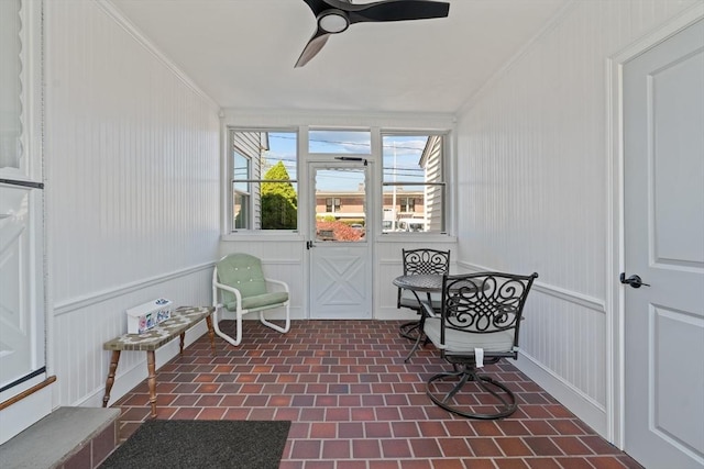 sunroom / solarium with ceiling fan