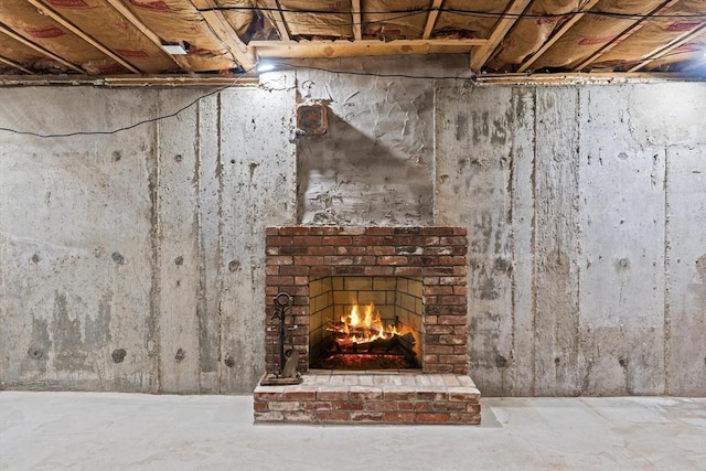 details with concrete floors and a fireplace