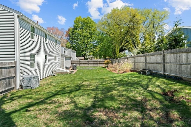 view of yard with cooling unit and a fenced backyard