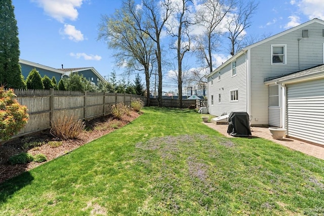 view of yard with a fenced backyard
