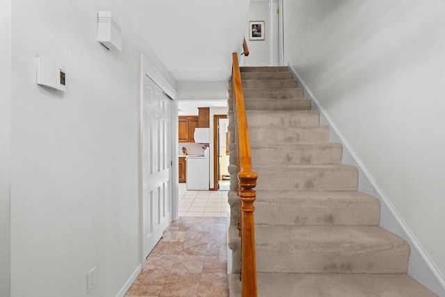 stairs featuring baseboards