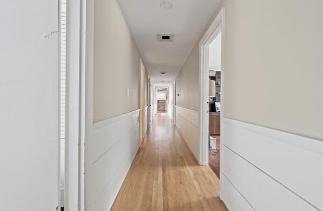 hallway featuring light hardwood / wood-style flooring