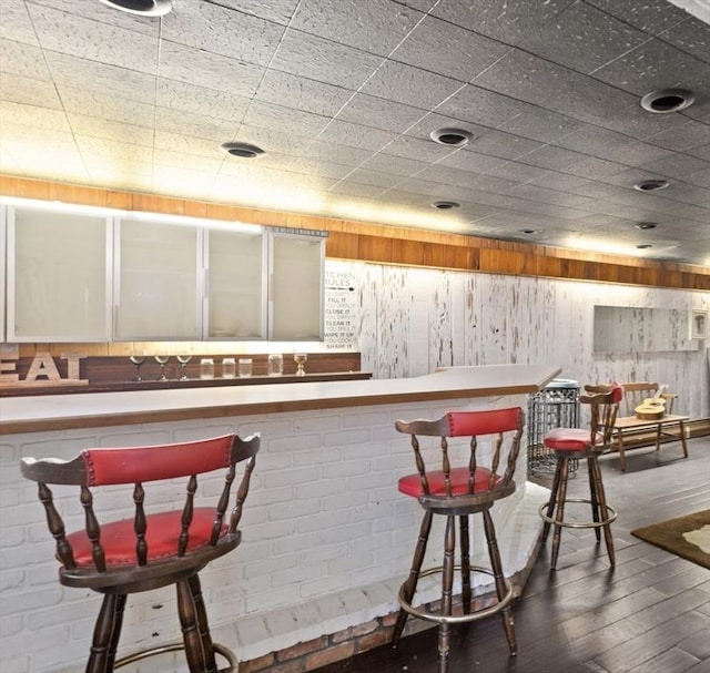 bar featuring hardwood / wood-style floors