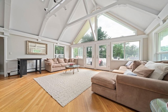 sunroom / solarium with vaulted ceiling with beams and baseboard heating