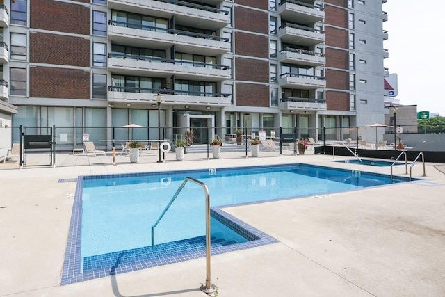 view of swimming pool with a patio