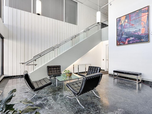 living room with a high ceiling