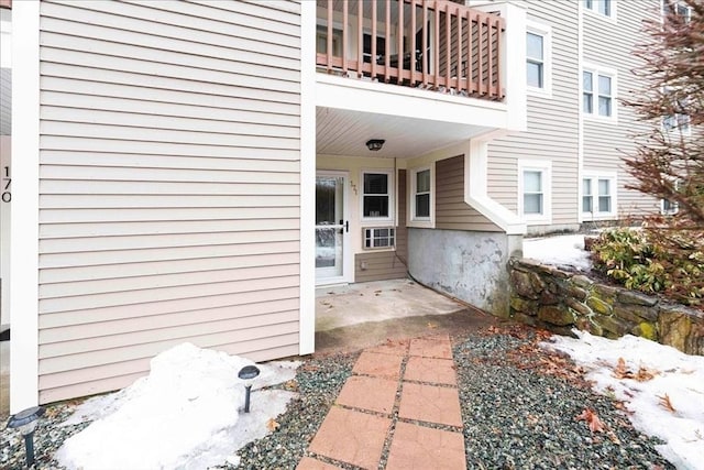 entrance to property with a patio and a balcony