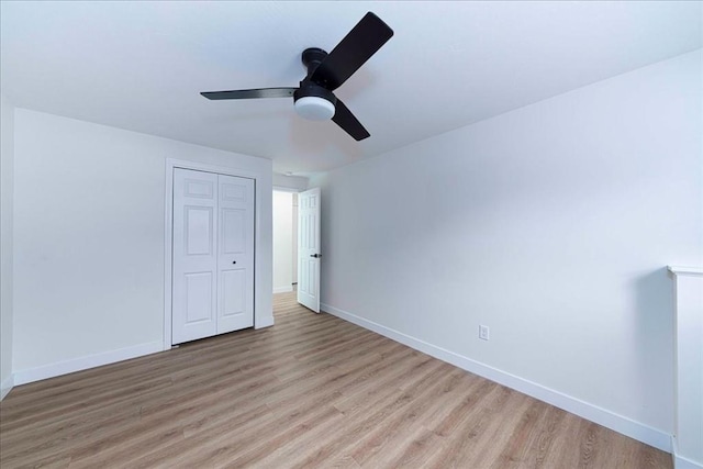 unfurnished bedroom featuring light wood-style flooring and baseboards