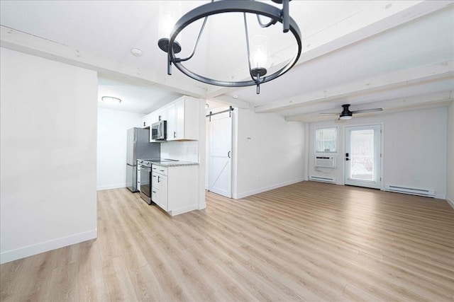 unfurnished living room with a baseboard radiator, light wood-style floors, a barn door, and beam ceiling