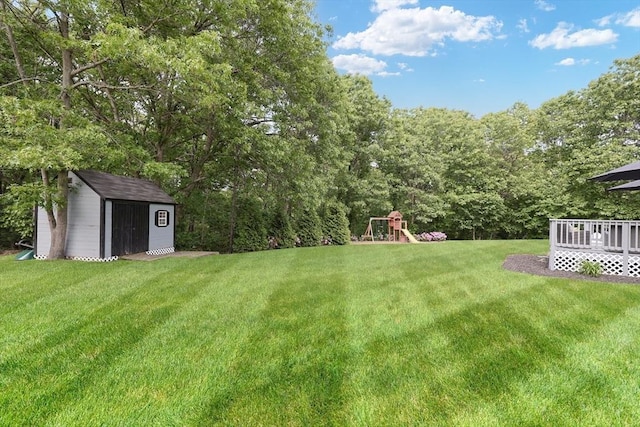 32 Lowe Meadow Ln, North Attleboro, MA 02760 - view of green lawn with a playground and a deck