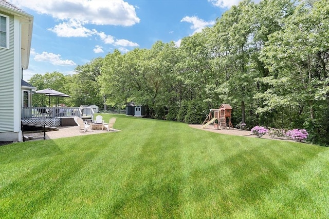32 Lowe Meadow Ln, North Attleboro, MA 02760 - view of green lawn featuring a playground and view of scattered trees