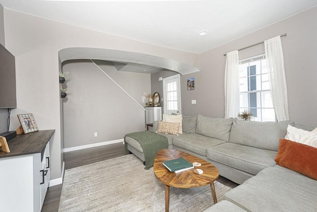 3 Worcester, Clinton, MA 01510 - living room with arched walkways, dark wood finished floors, and plenty of natural light