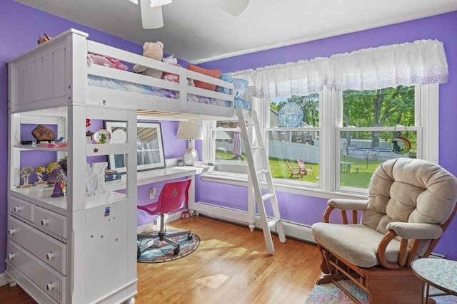 167 Montaup Ave, Dracut, MA 01826 - bedroom with multiple windows, wood finished floors, and a ceiling fan