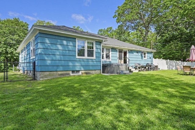 167 Montaup Ave, Dracut, MA 01826 - back of house with a hot tub and a gate