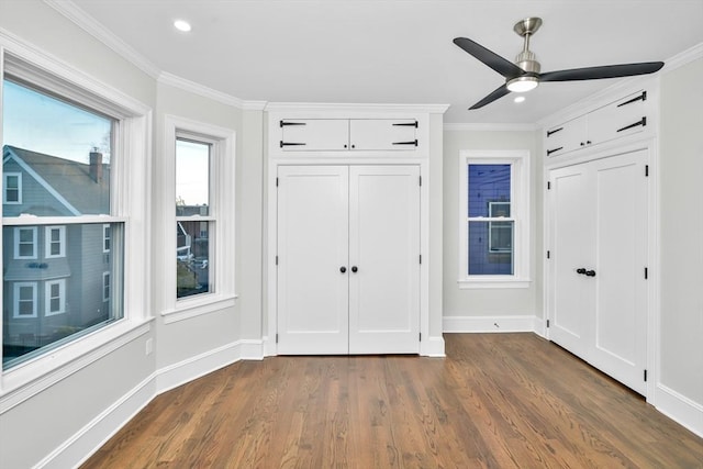 unfurnished bedroom featuring ceiling fan, dark hardwood / wood-style flooring, and ornamental molding