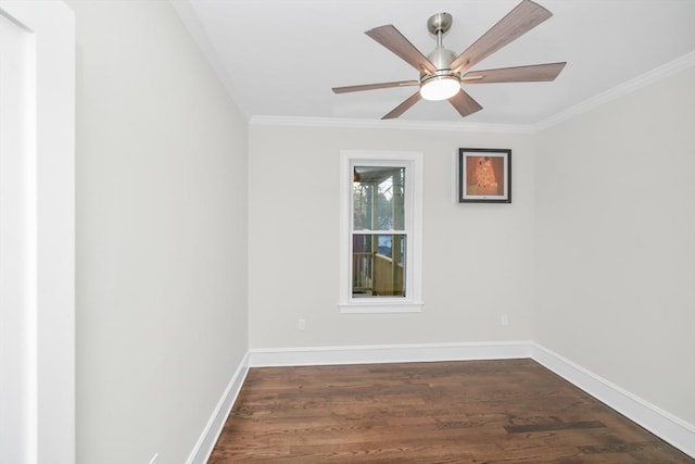 spare room with dark hardwood / wood-style flooring, ceiling fan, and crown molding