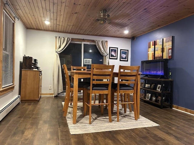 dining area featuring wooden ceiling, a baseboard heating unit, and wood finished floors